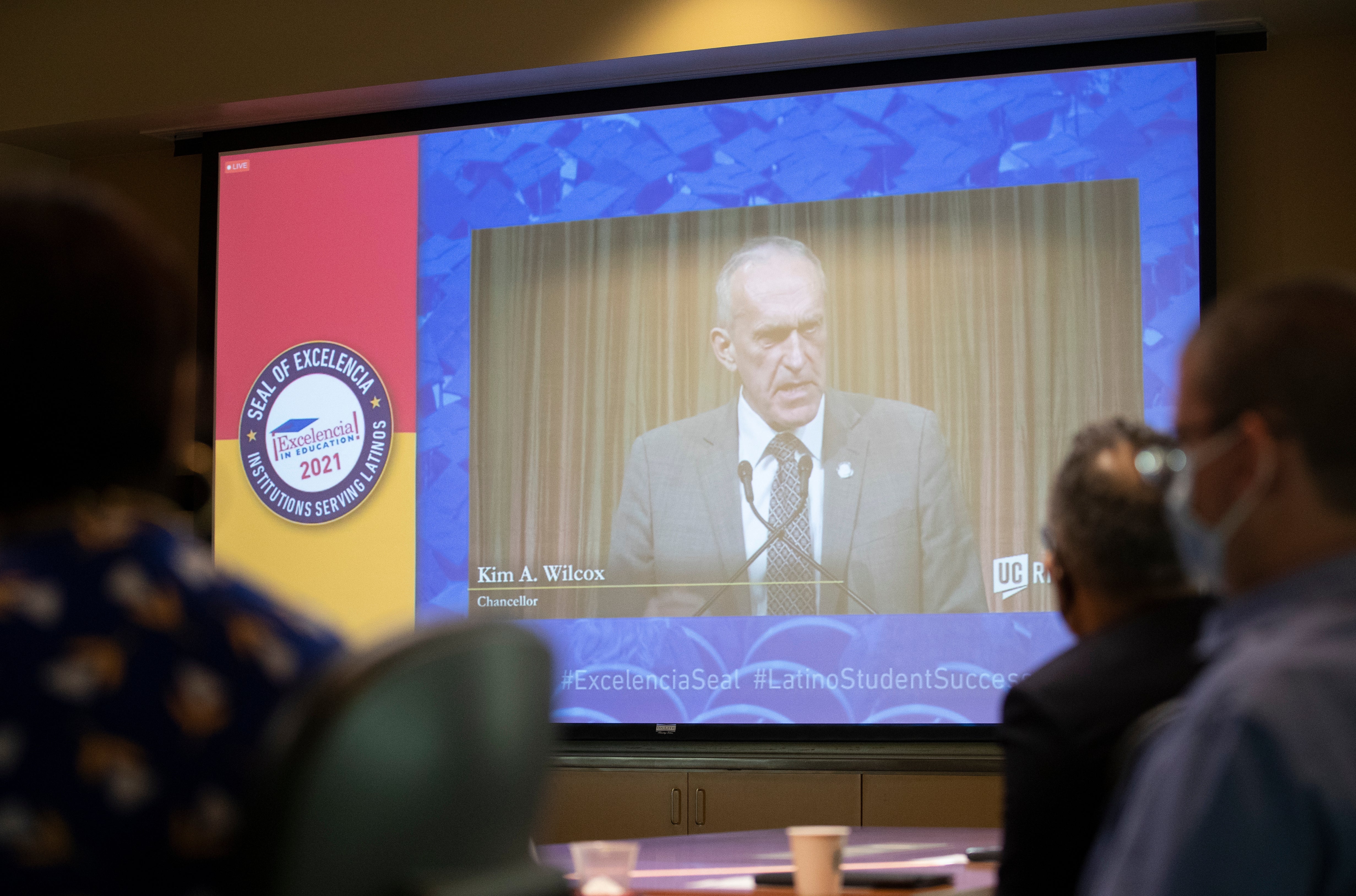 Guest watch as Chancellor Kim Wilcox is streamed live from Washington D.C. as he excepts the Seal of Excelencia award for UCR on Friday, October 29, 2021, at UC Riverside. UCR and several other universities received the Seal of Excelencia in Education certification during an event in Washington, D.C. (UCR/Stan Lim)