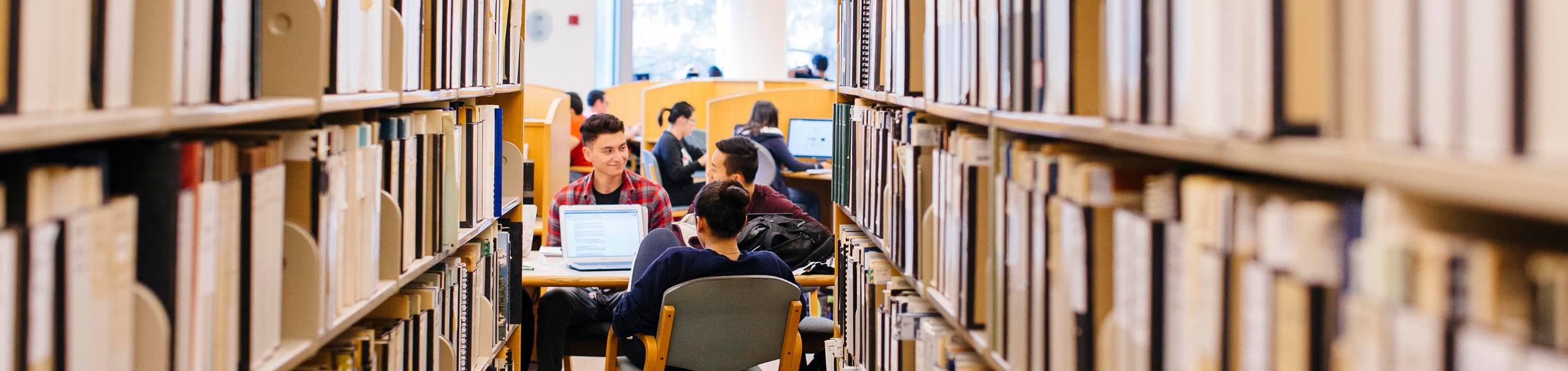 Students working at a table in the library