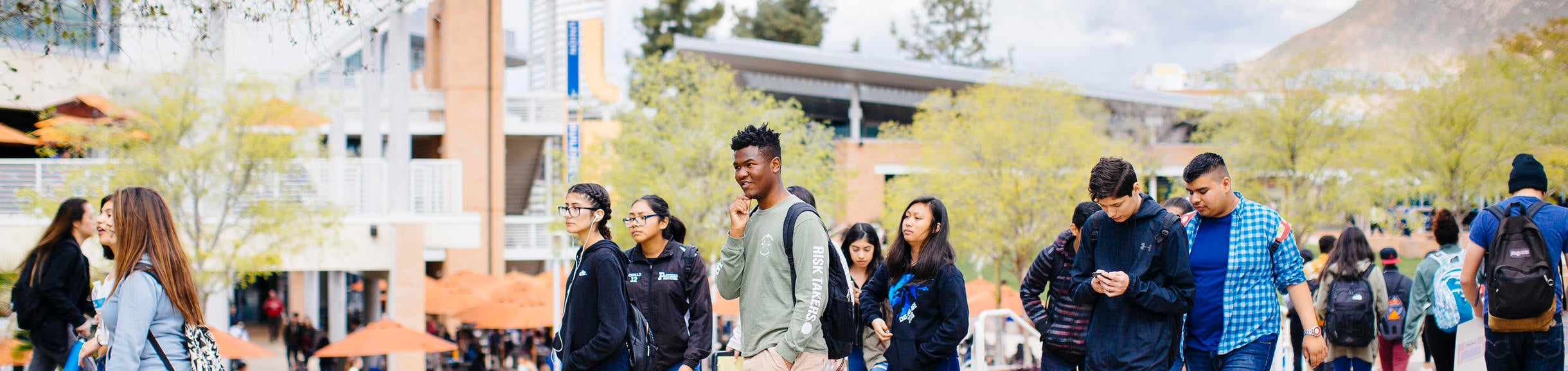 Students walking through the HUB Plaza