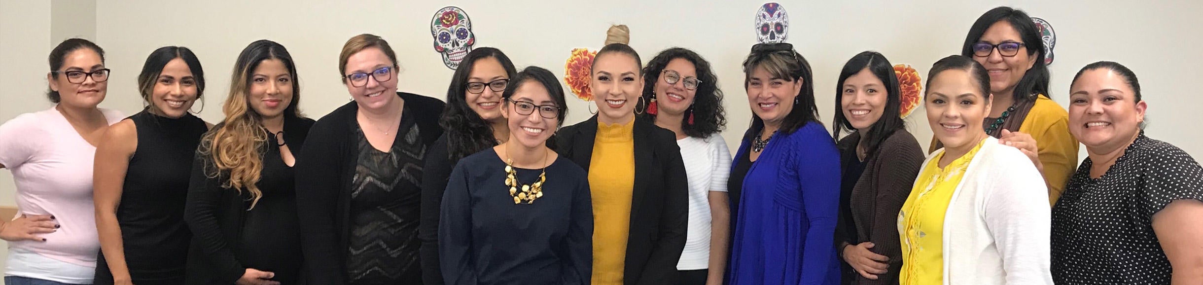 Thirteen female members of the Latina/Chicana Staff and Faculty Group (LCSFG).